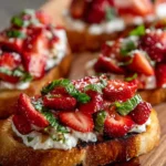 Delicious Strawberry Ricotta Bruschetta topped with fresh strawberries and mint