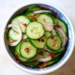 Sweet and sour Asian pickled cucumbers in a bowl