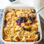 Baked blueberry French toast casserole with fresh blueberries on top