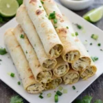 Baked green chile chicken taquitos served with dipping sauce