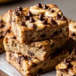 Freshly baked banana bars on a wooden table