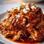 Delicious BBQ chicken cooked in a crockpot, ready to serve