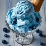 Delicious Blue Moon Ice Cream in a bowl with sprinkles and a spoon.
