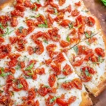 Delicious bruschetta pizza topped with fresh tomatoes and basil