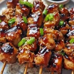 Chicken Teriyaki Skewers grilled and glazed with teriyaki sauce