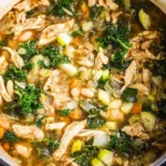 Delicious kale chicken soup with white beans and fresh vegetables