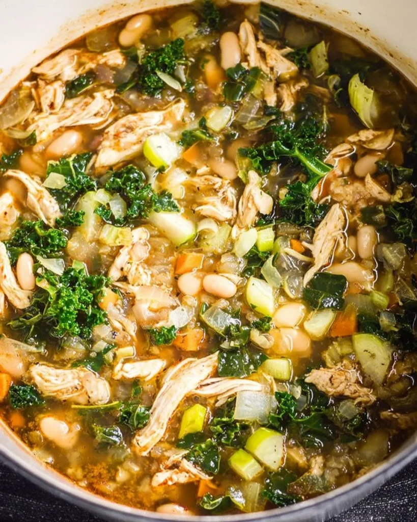 Delicious kale chicken soup with white beans and fresh vegetables