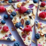 Delicious homemade frozen yogurt bark topped with fruits and nuts