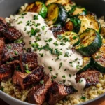 Delicious grilled steak bowl topped with fresh vegetables and sauce