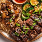 Delicious Hibachi Steak served with vibrant vegetables and dipping sauces