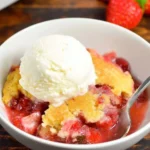 Lemon Basil Strawberry Cobbler topped with fresh basil and lemon slices