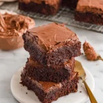 Delicious Lunch Lady Brownies topped with chocolate frosting on a plate