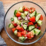 Marinated cucumber and tomato salad with fresh herbs and dressing