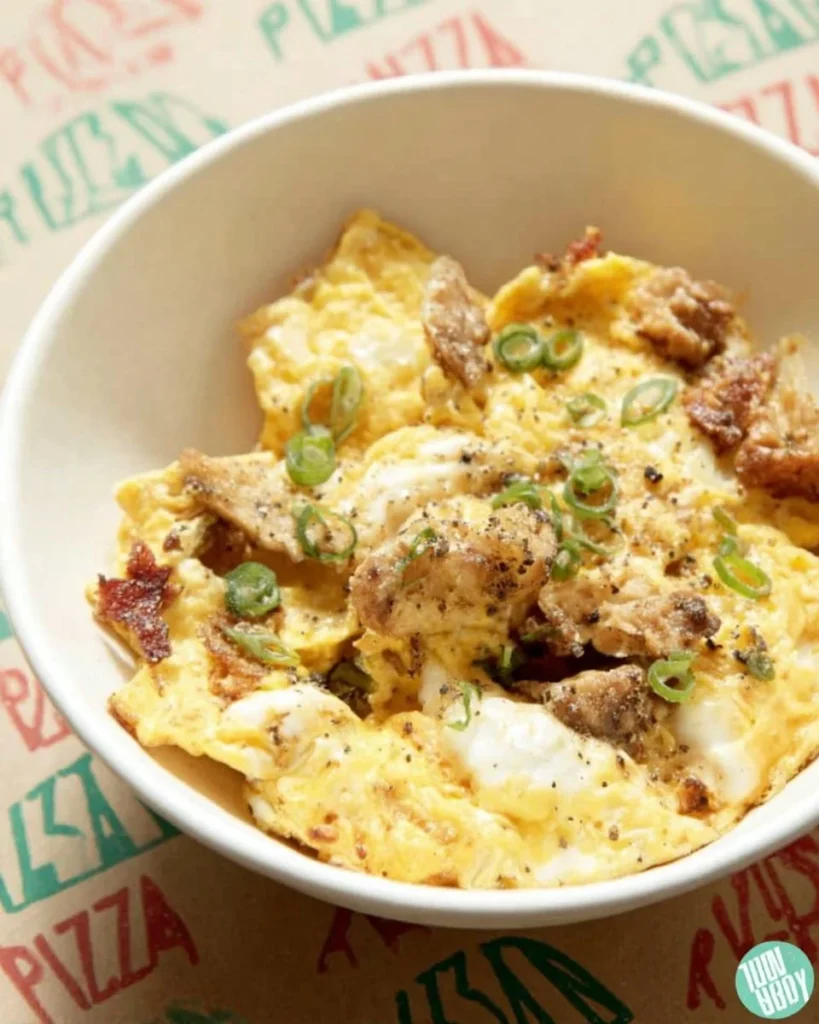 A delicious plate of Pizza Eggs topped with cheese and fresh ingredients.