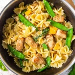 Plate of Teriyaki Chicken Pasta with fresh vegetables and sauce