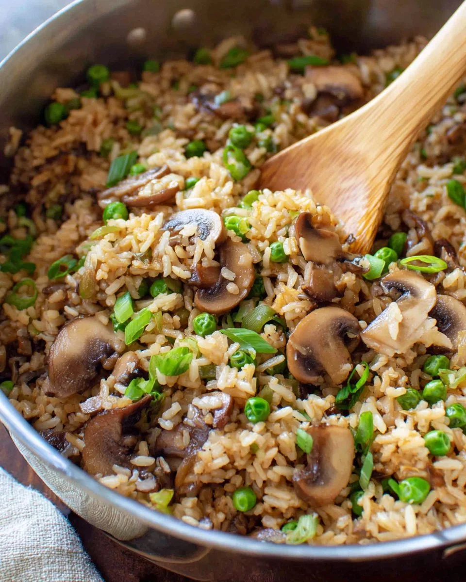 Delicious Teriyaki Rice Pilaf with mushrooms and peas in a bowl