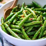 Asian green bean salad with colorful vegetables and sesame dressing