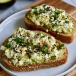 Avocado Cottage Cheese Toast topped with fresh ingredients on whole grain bread.