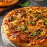 Delicious Birria Pizza topped with cheese and spices, served hot