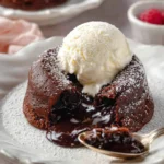 Delicious chocolate lava cakes with molten chocolate center served on a plate.