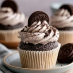 Delicious Cookies and Cream Cupcakes topped with Oreo pieces