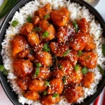 Delicious homemade Easy Orange Chicken served with rice and vegetables.