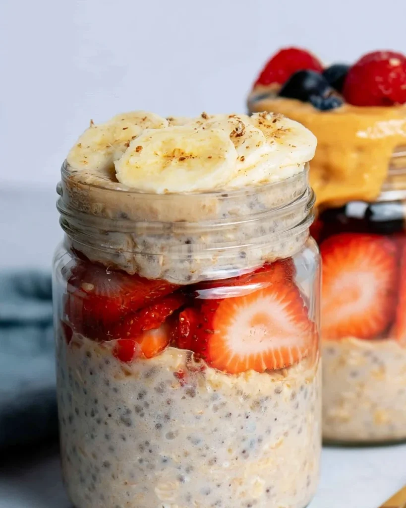 Bowl of high-protein overnight oats topped with fruits and nuts