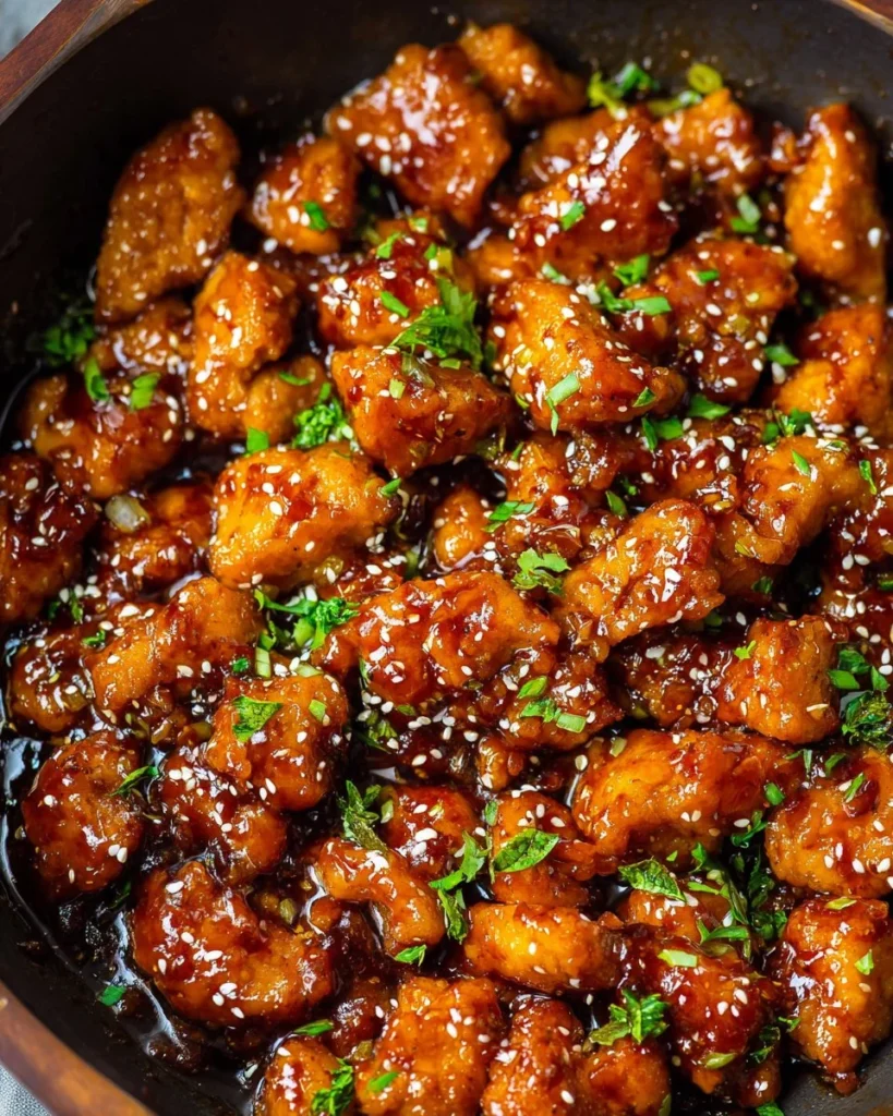 Plate of Honey Sriracha Chicken served with vegetables