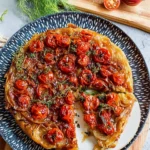 Sweet Tomato and Fennel Tarte Tatin served on a rustic plate