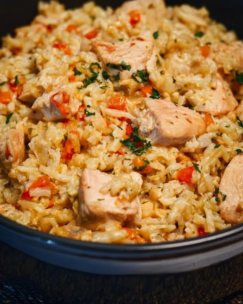 Delicious Chicken Bog served in a bowl with herbs and spices.