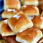 Freshly baked Copycat Texas Roadhouse Rolls on a serving plate