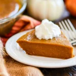 Delicious crustless pumpkin pie served in a rustic setting with autumn decorations