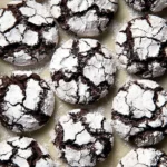 Delicious double chocolate crinkle cookies stacked on a plate.