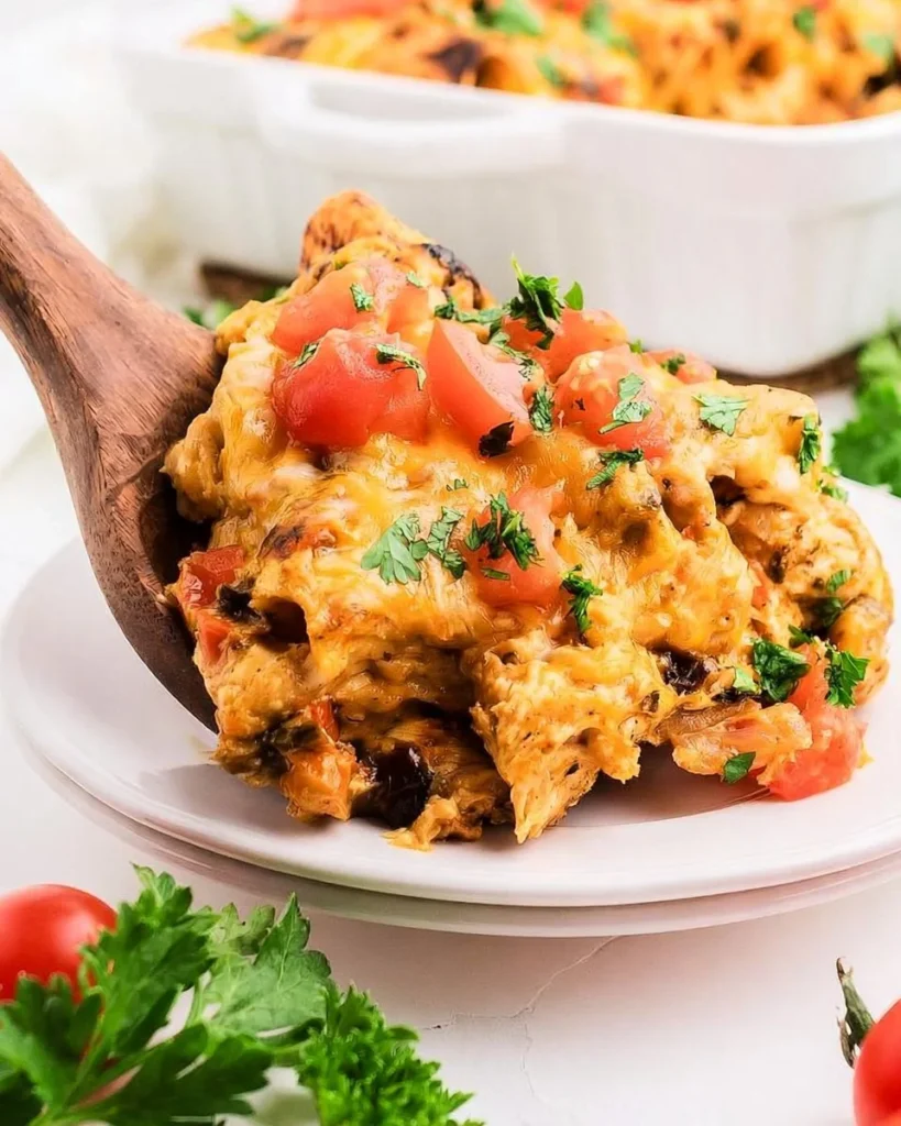 Easy Chicken Enchilada Casserole topped with cheese and garnished with cilantro