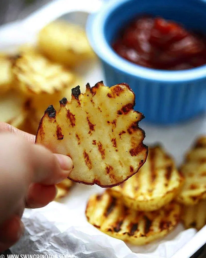 Deliciously grilled potato slices served on a plate.