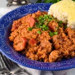 Delicious homemade Jambalaya served in a bowl with shrimp, sausage, and rice.