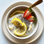 Bowl of Lemon Chia Oats topped with fresh fruit and nuts for a nutritious breakfast
