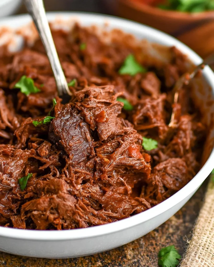 Delicious Mexican style braised short ribs served with garnishes