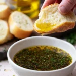 Bowl of olive oil dip served with fresh bread