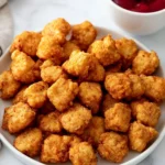 Crunchy and flavorful Popcorn Chicken served with dipping sauce
