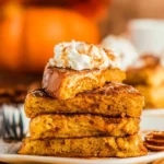 Delicious Pumpkin French Toast topped with syrup and whipped cream