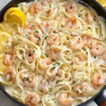 Delicious Shrimp Alfredo pasta with shrimp, creamy sauce, and garnished with parsley.