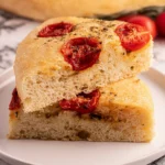 Homemade Tomato Focaccia bread topped with fresh tomatoes and herbs