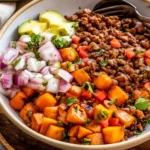 Healthy ground beef bowl recipe with vegetables and quinoa