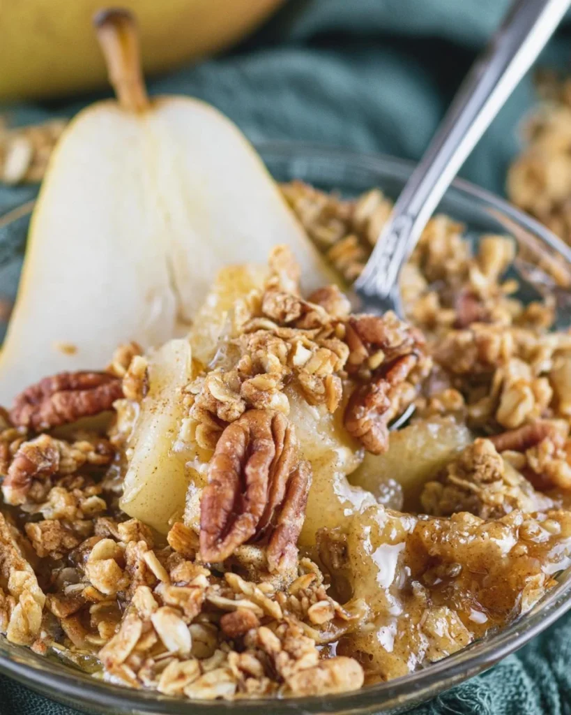 Warm Holiday Pear Crumble dessert with a crispy topping and juicy pears