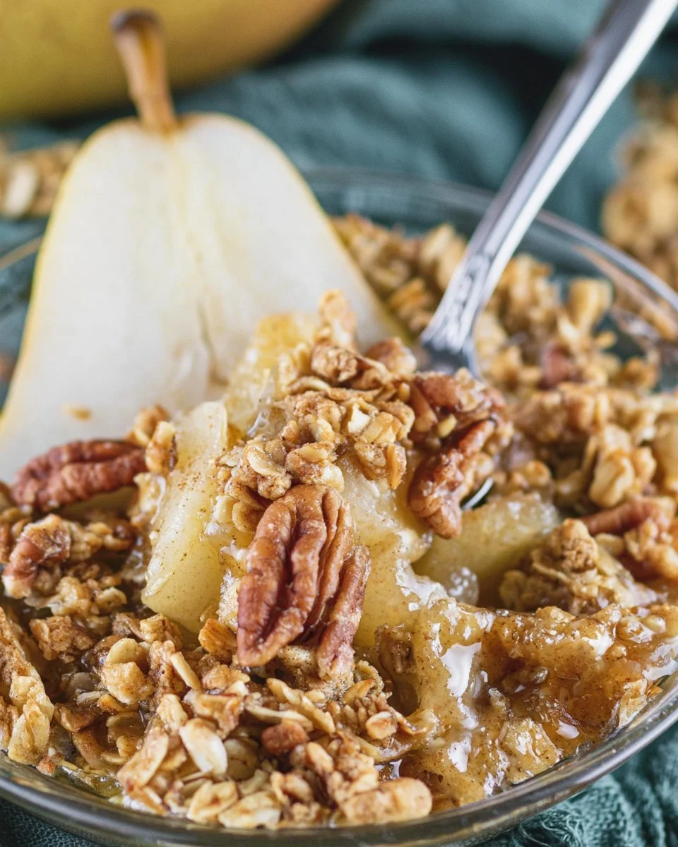 Warm Holiday Pear Crumble dessert with a crispy topping and juicy pears